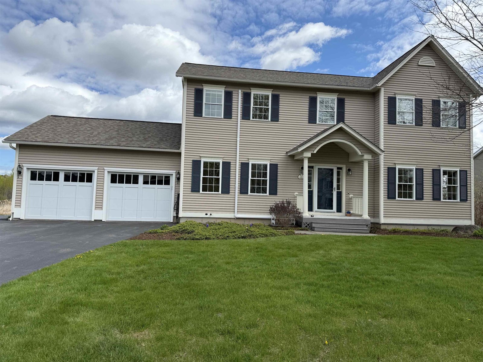 FRONT YARD W/ PERENNIAL FLOWER BEDS