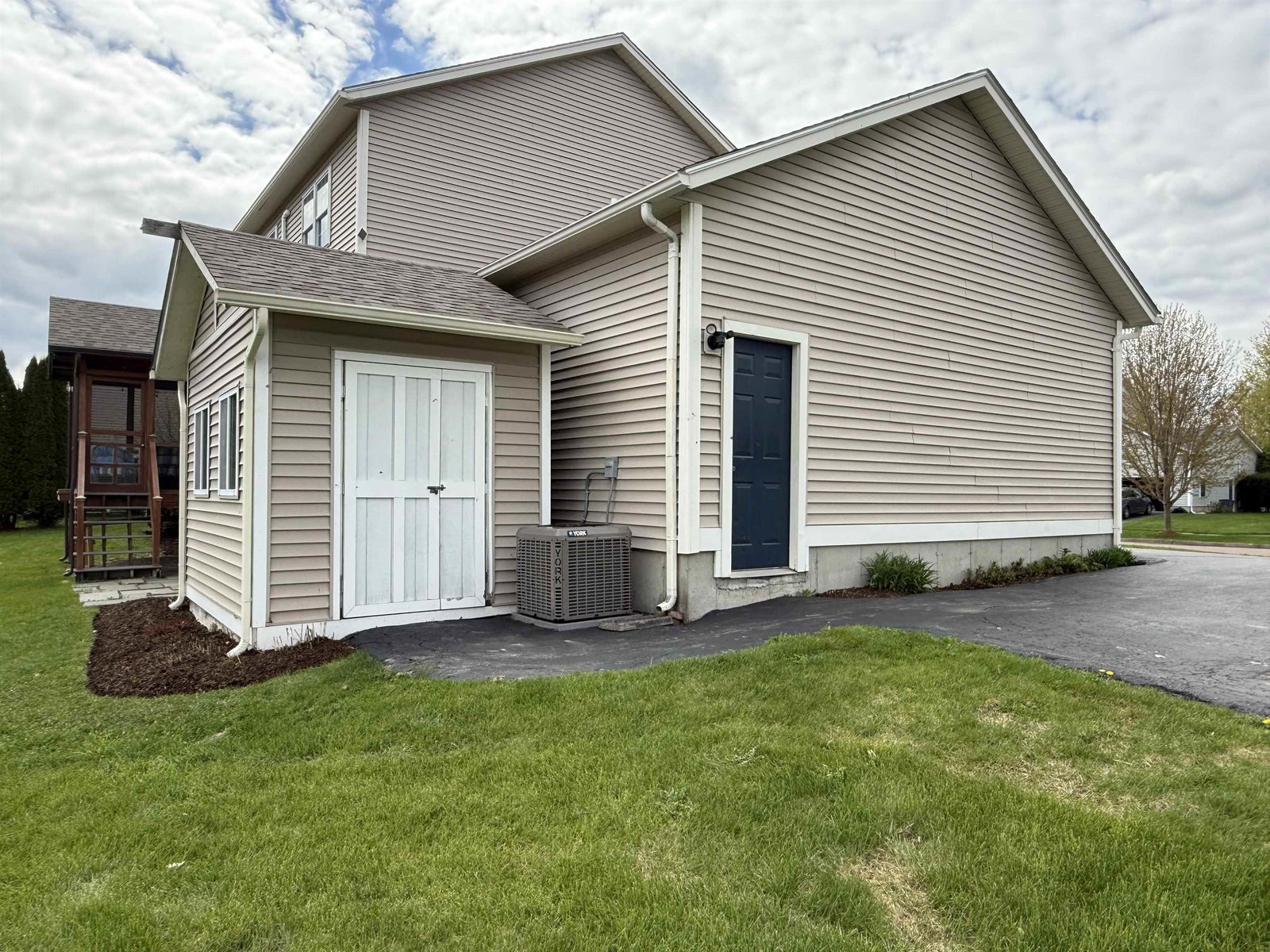 SHED, CENTRAL AIR AND SIDE ENTRANCE TO GARAGE