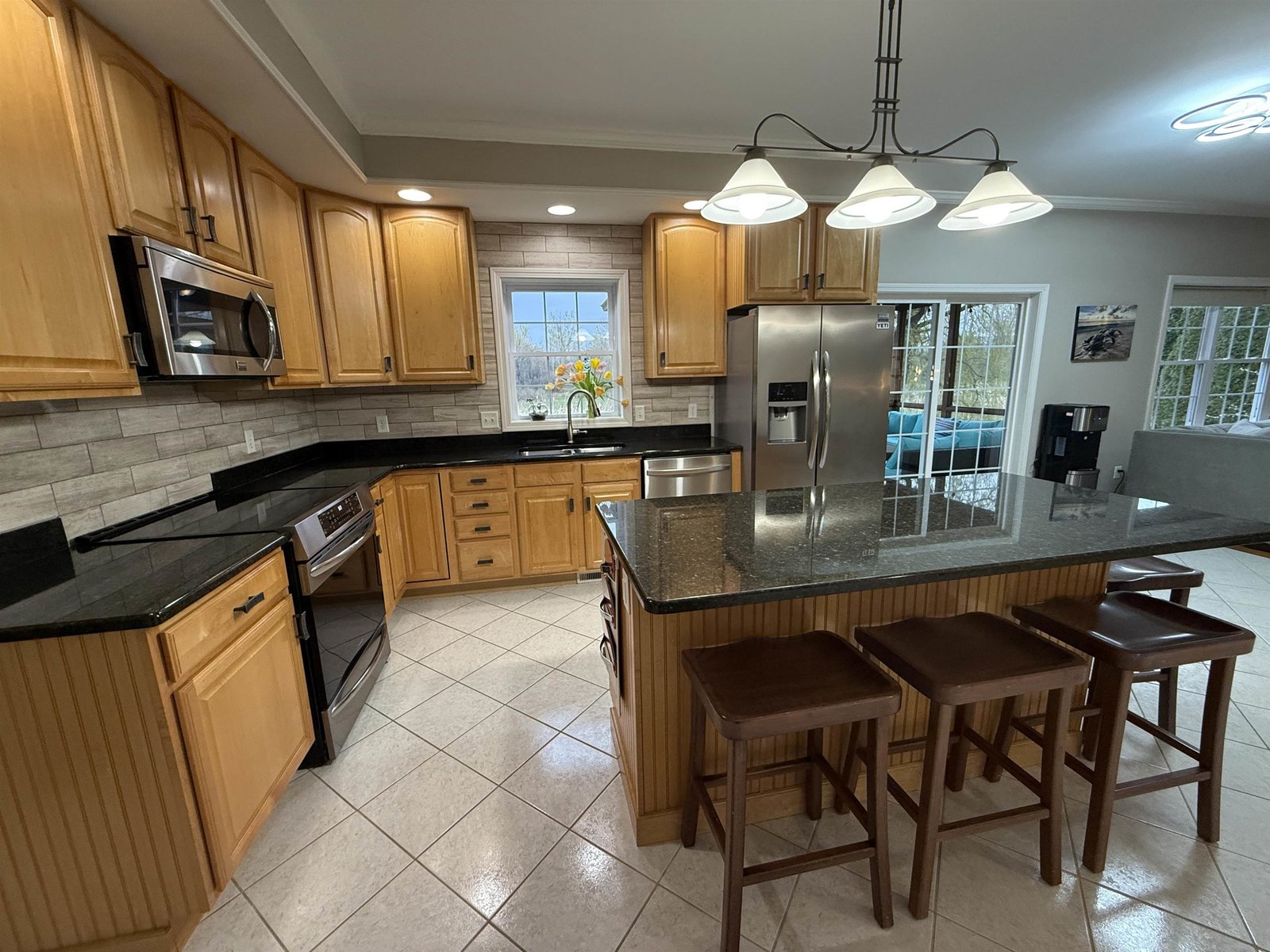 LARGE CENTER ISLAND WITH GRANITE COUNTER TOP