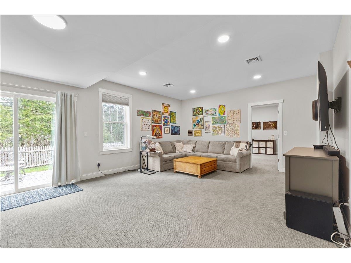 Upper level shared bathroom with tile floor.
