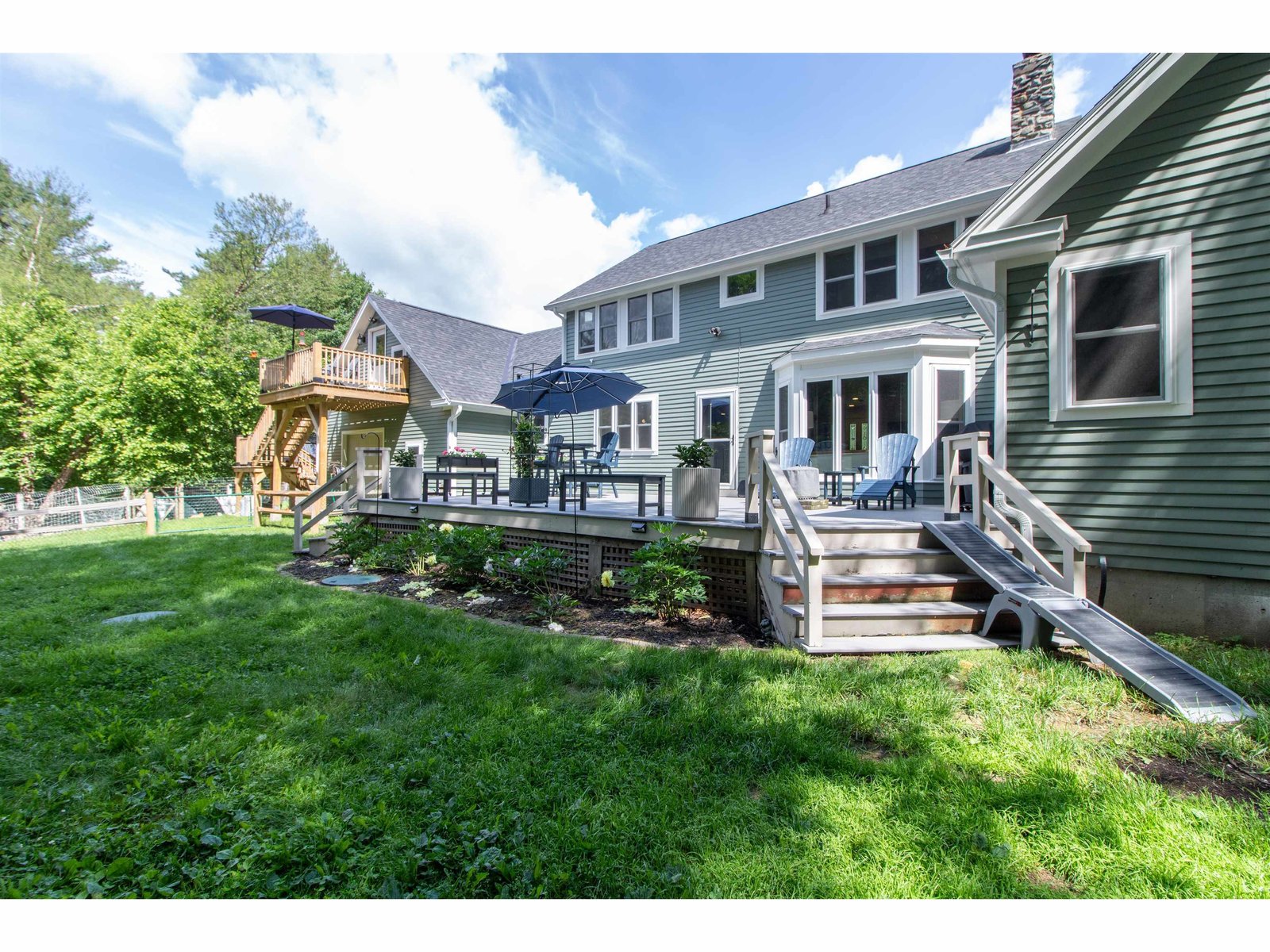Back of the house with large deck off the living area