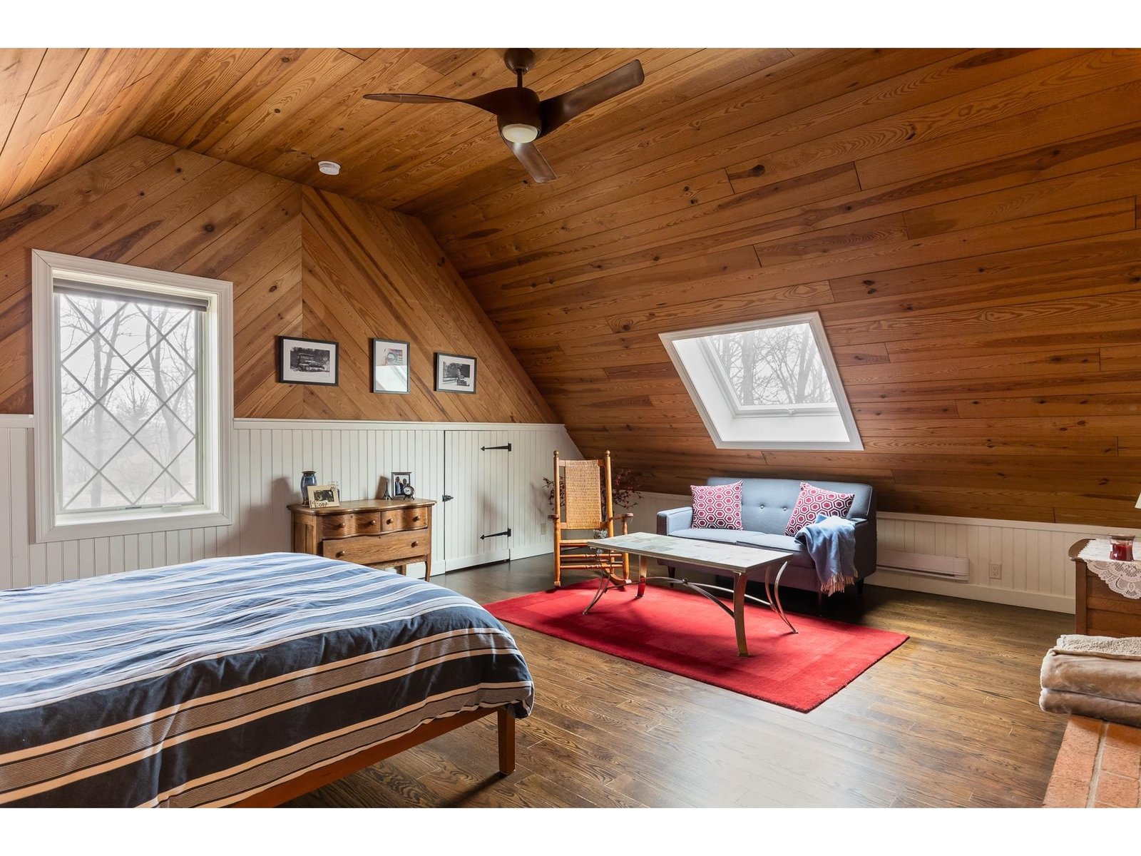 4th bedroom with custom Pella casement window and Veloux skylight
