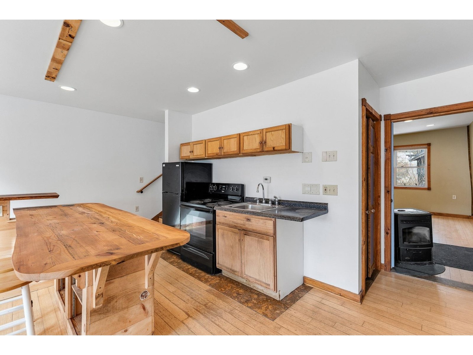 Kitchen, looking towards bedroom/office area