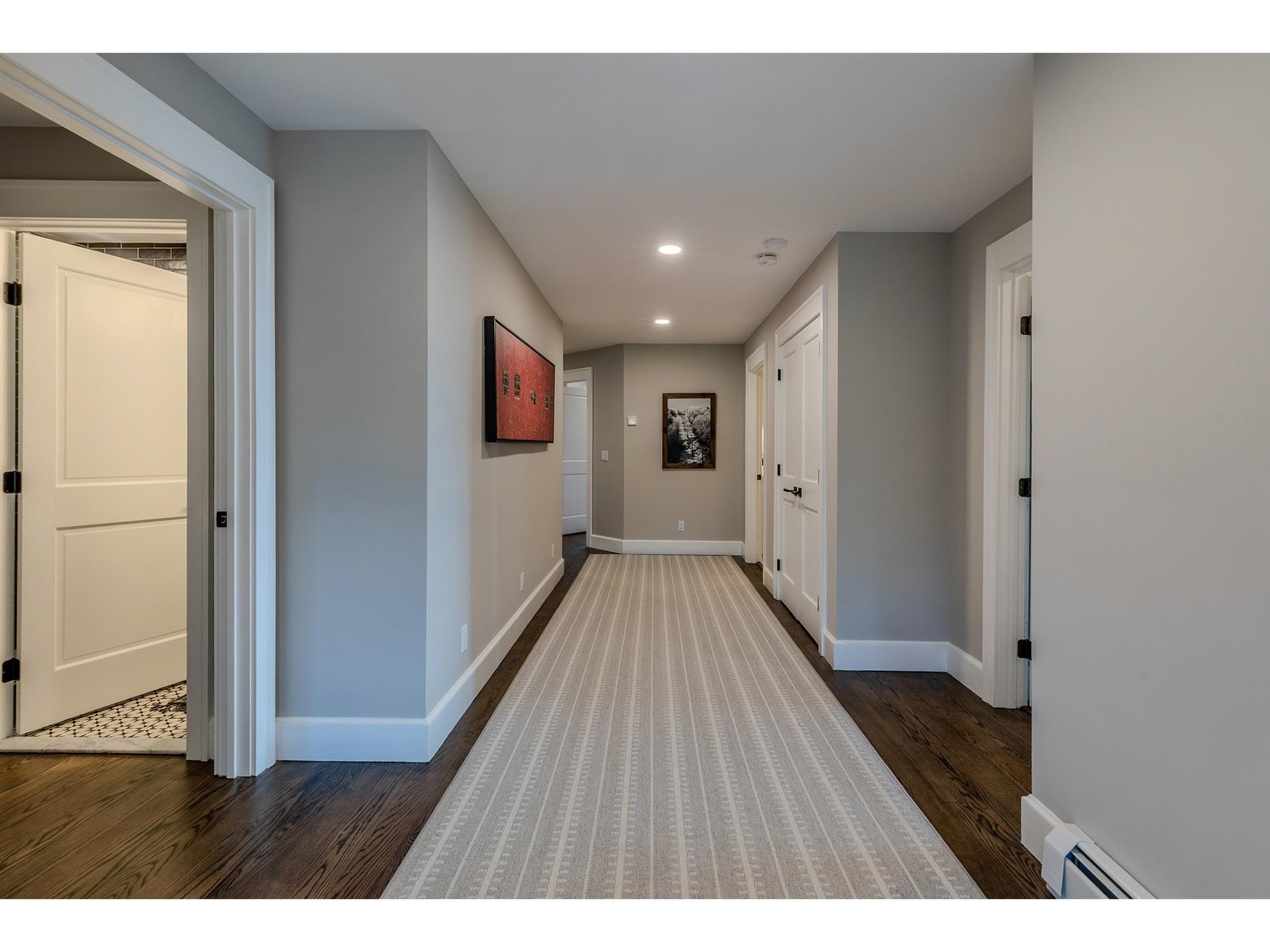Second floor hall w/ hardwood floors