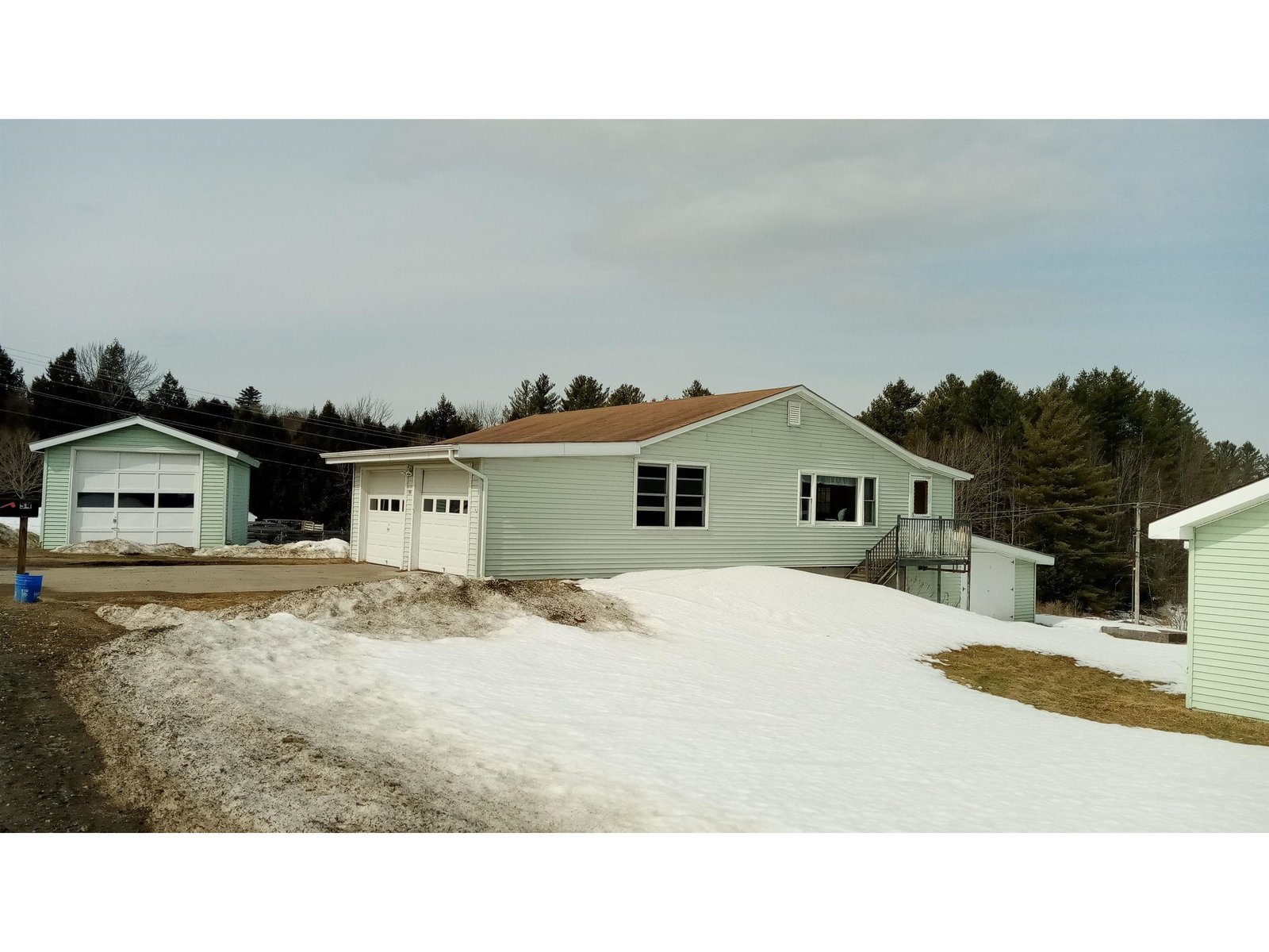 East side of home with one car garage