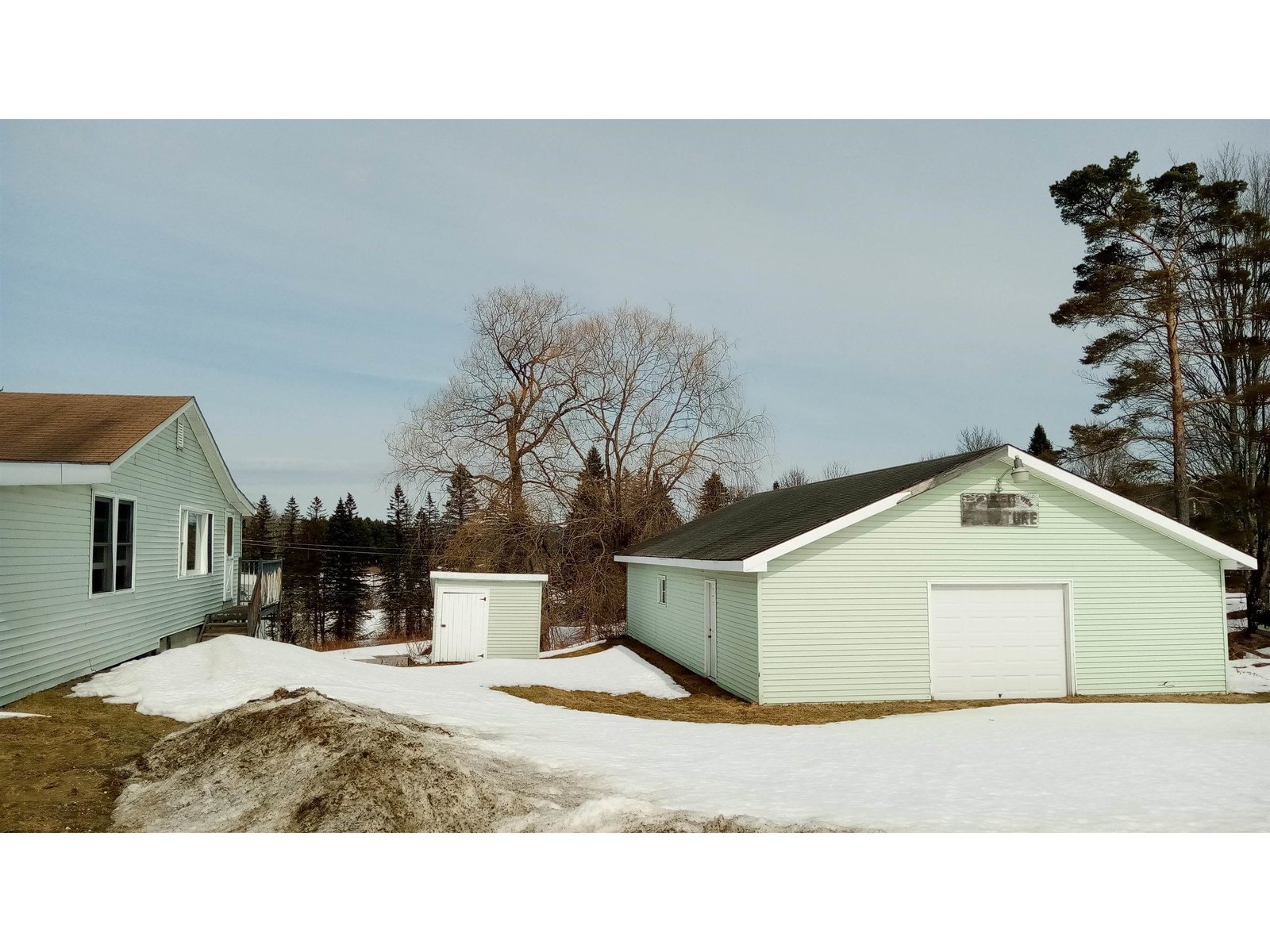 large garage with small shed