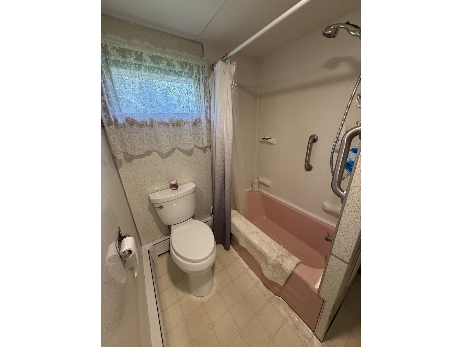 Bathtub and stool in bathroom