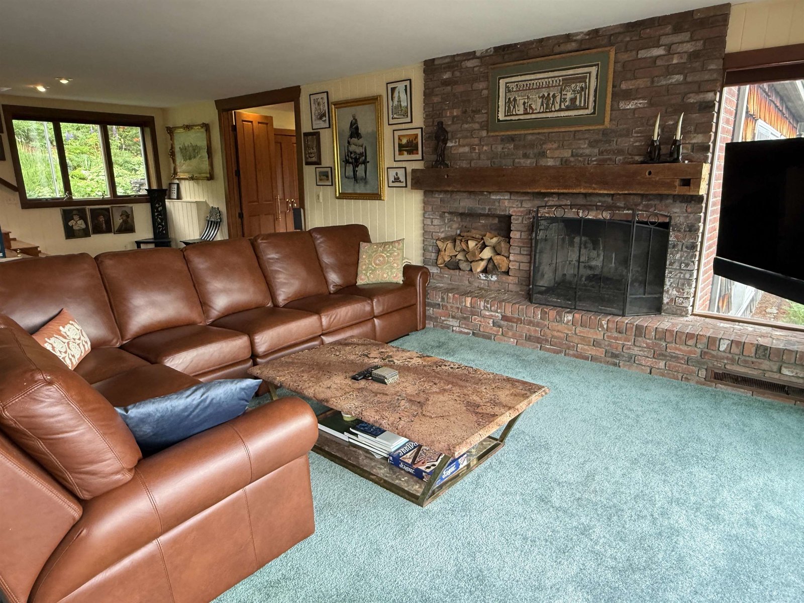 LIVING ROOM W/ FIREPLACE AND A BIG WEST VIEW