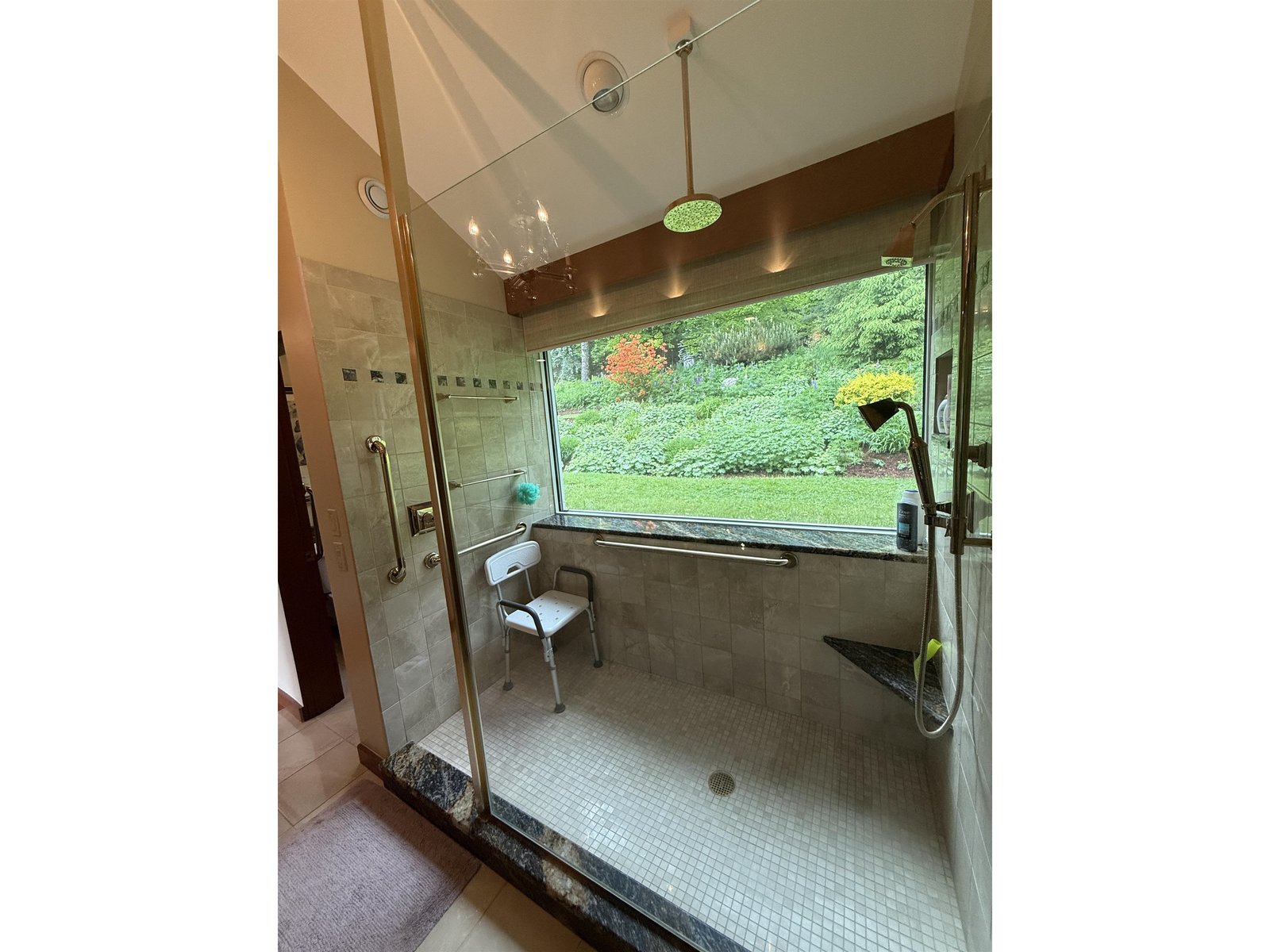 LARGE RAIN SHOWER WITH A SCENIC VIEW