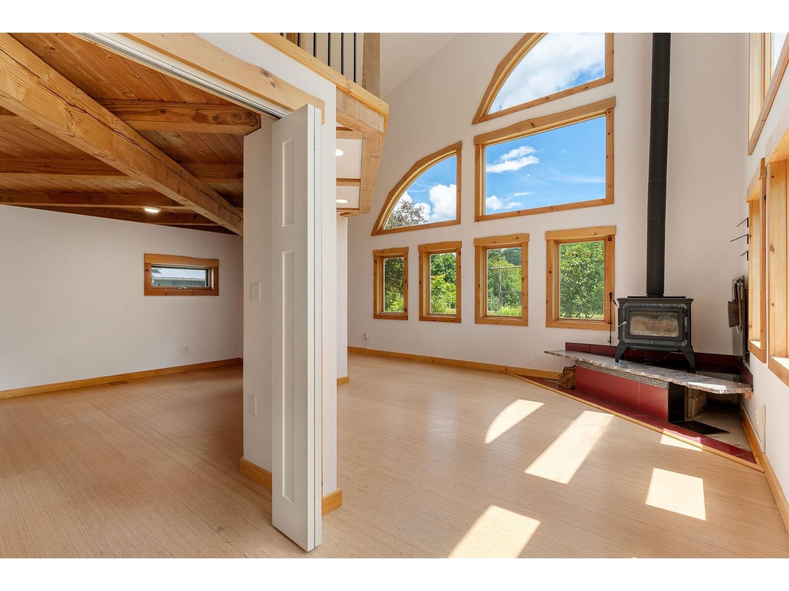 2 soaring walls of windows- bringing the outside, in.