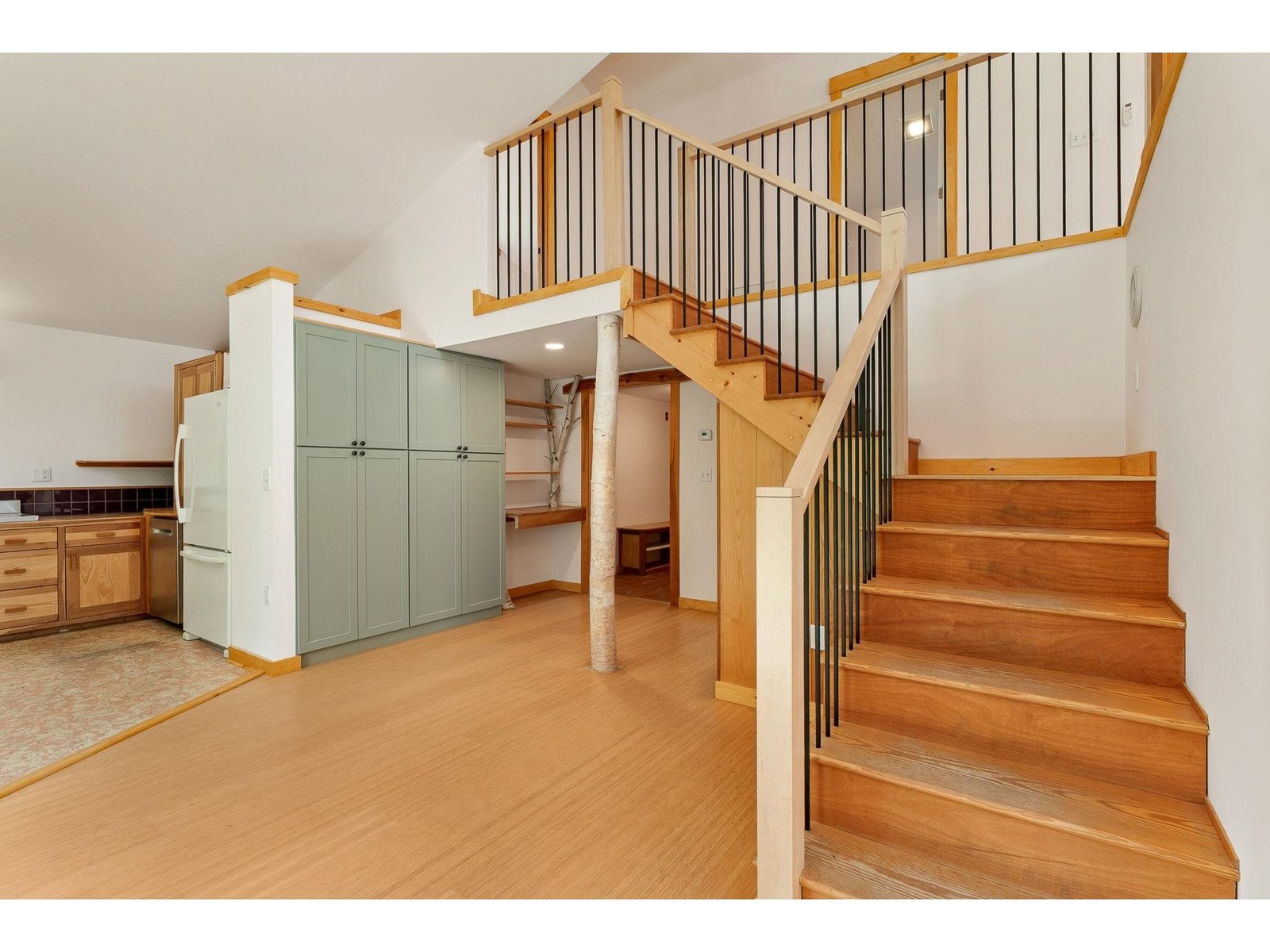 Stairway to loft, bedroom and full bath