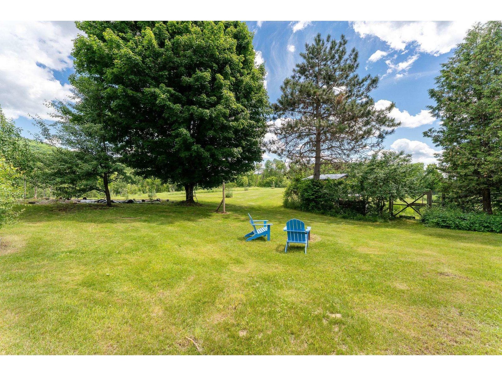 Verdant gardens include raspberries, blueberries, apple trees and an herb garden