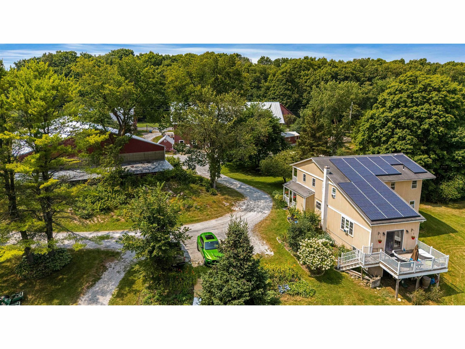 view of house solar and parking spaces