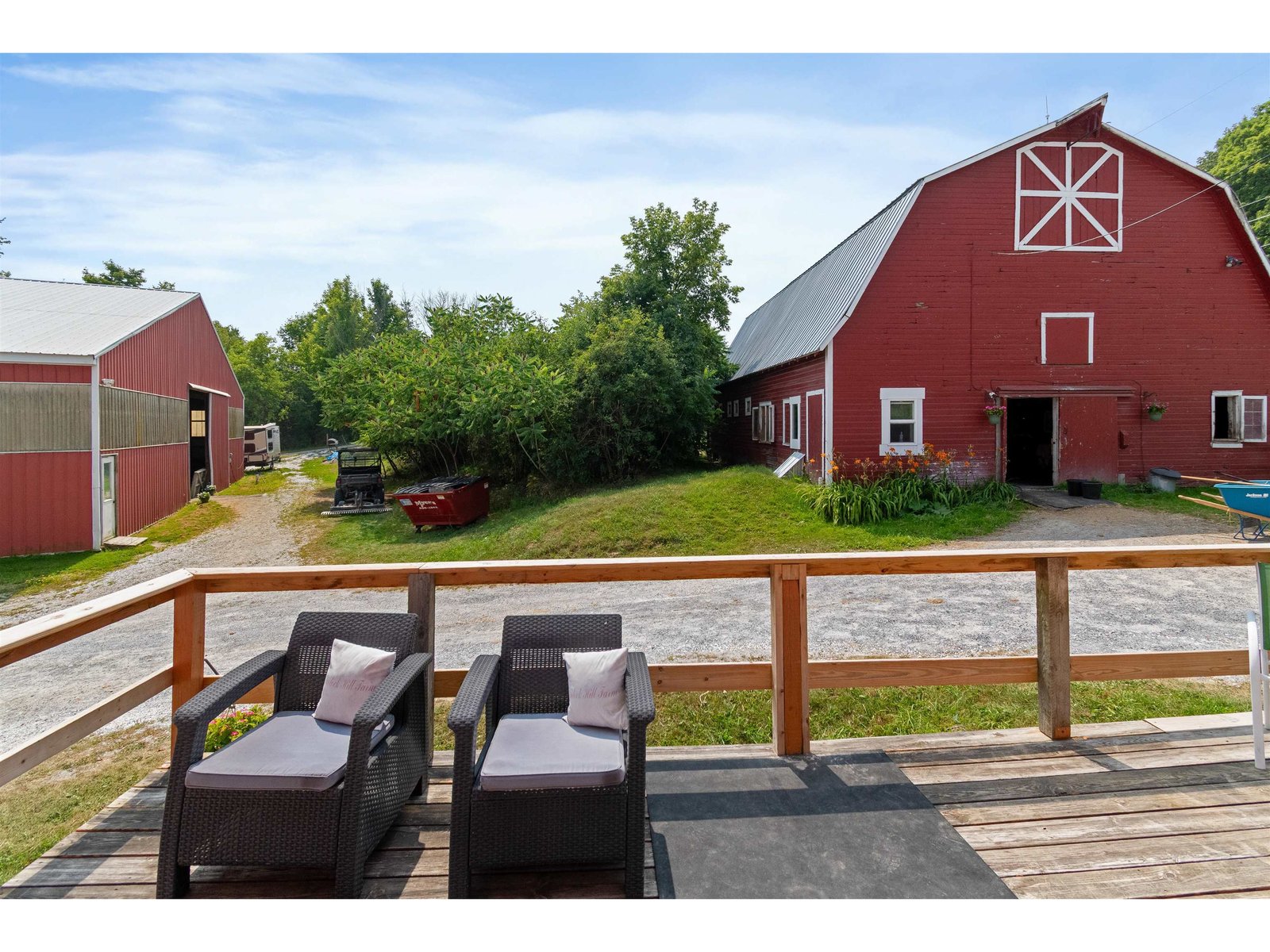 deck off the south side of the main barn overlooking upper barn
