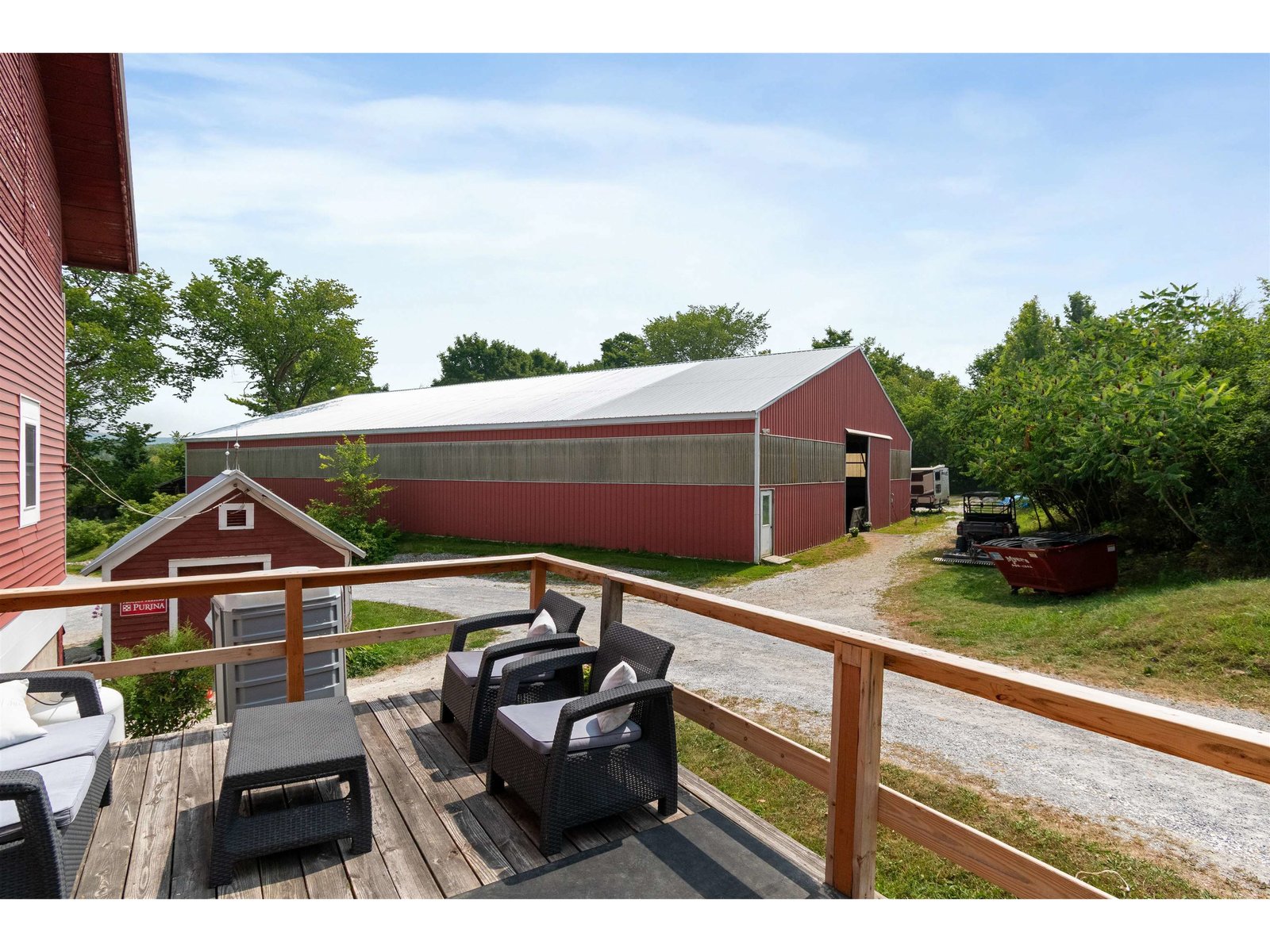 deck off barn overlooking indoor arena