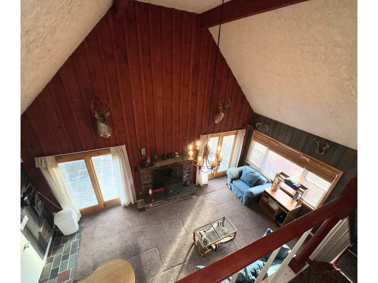Great Cathedral Ceiling Living Area with FP/Wood stove and sliders to the Deck
