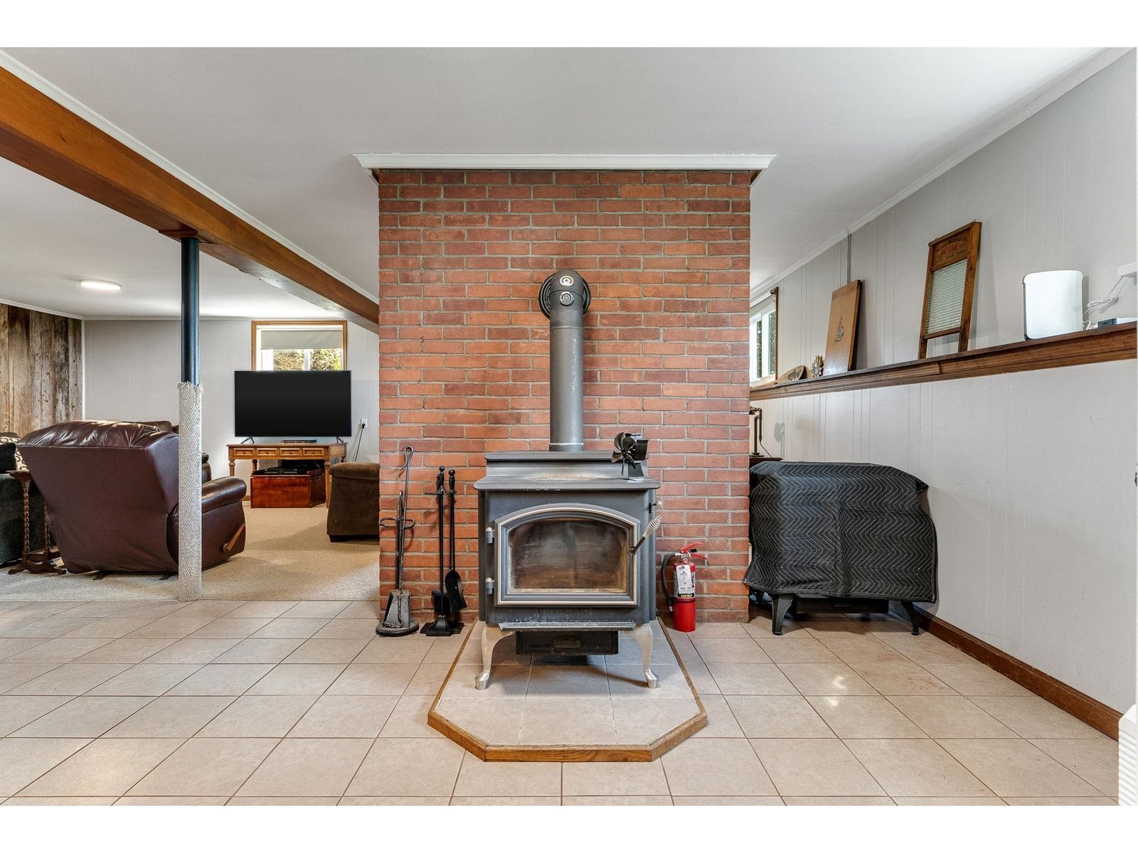 Woodstove insert faces living area