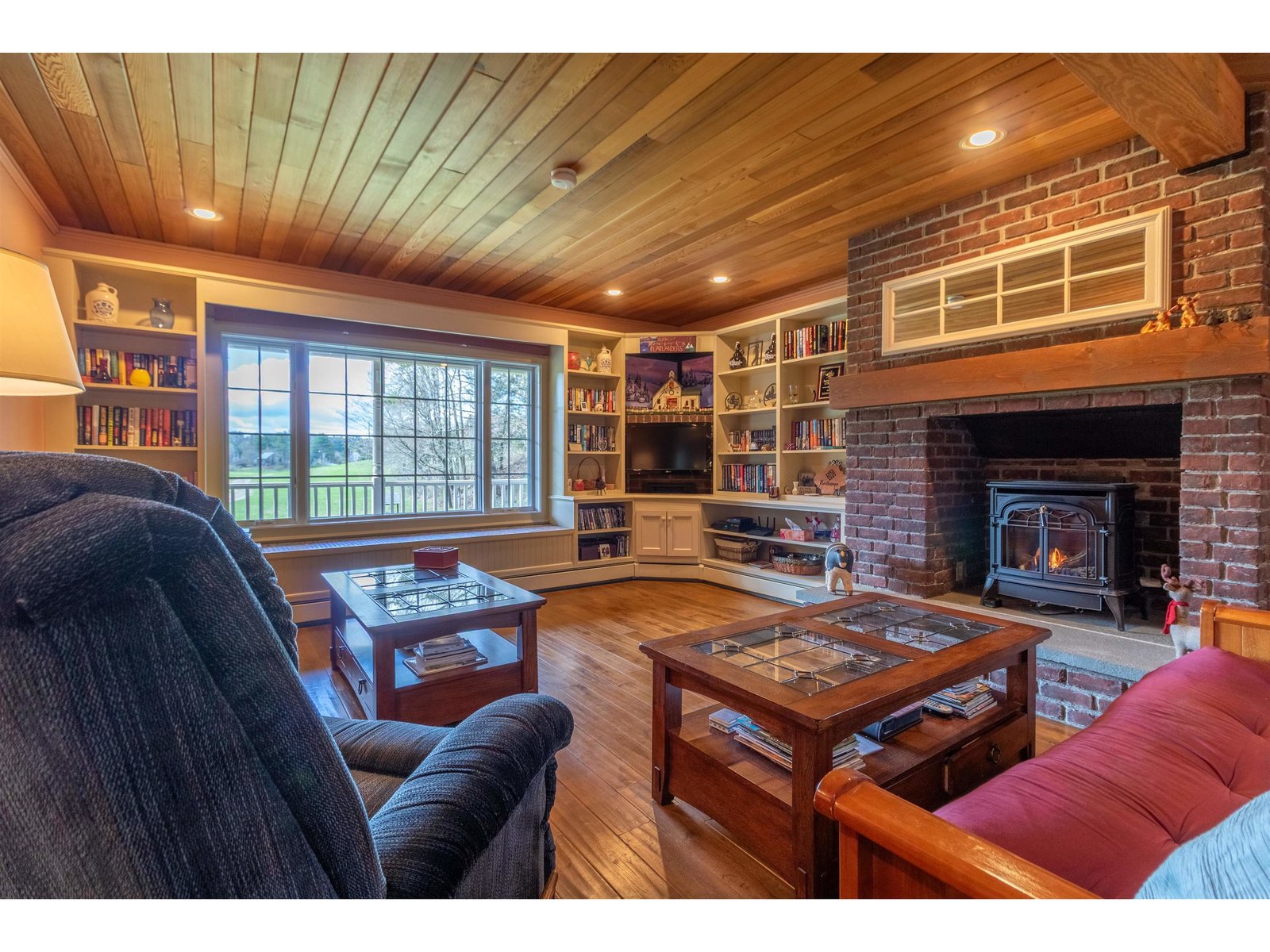 Cozy living area with wood floors and ceiling