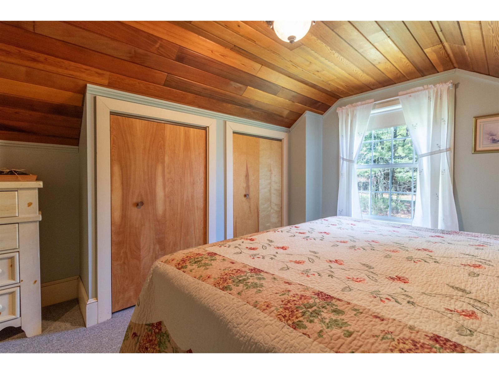 Master bedroom with double closet & wood ceiling