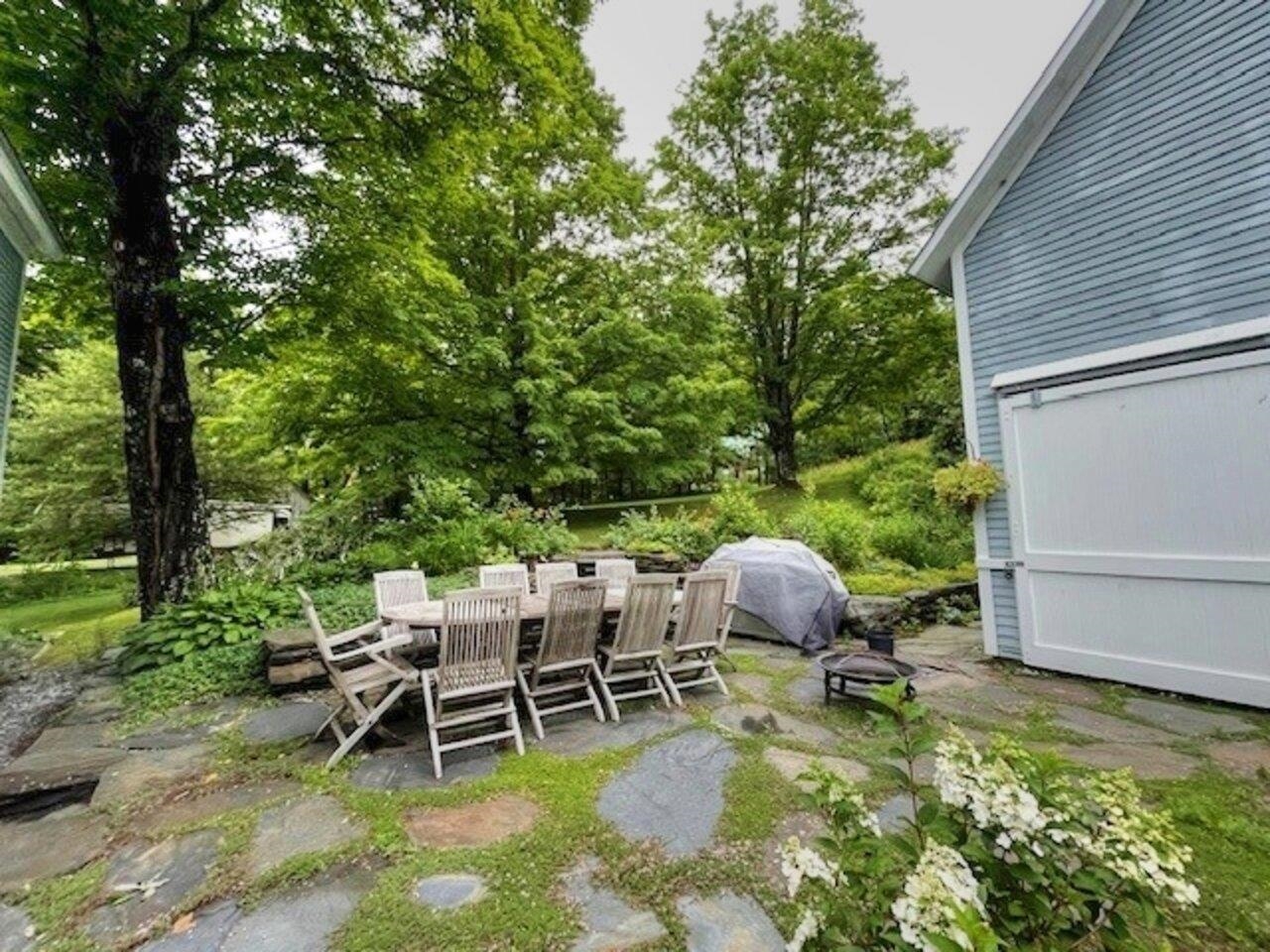Patio and landscaped backyard