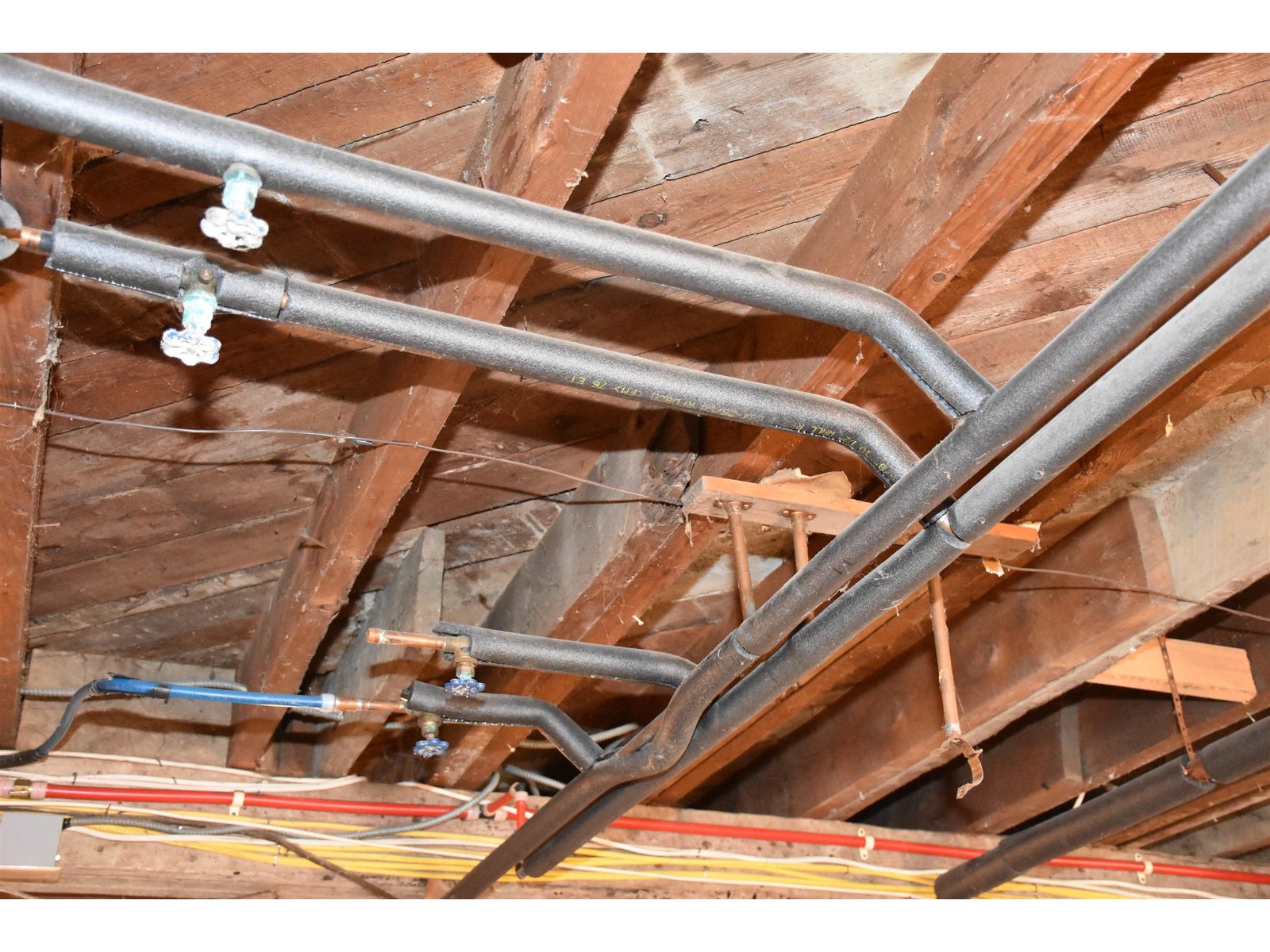 Pipes and wiring in basement lifted - raises height for finishing