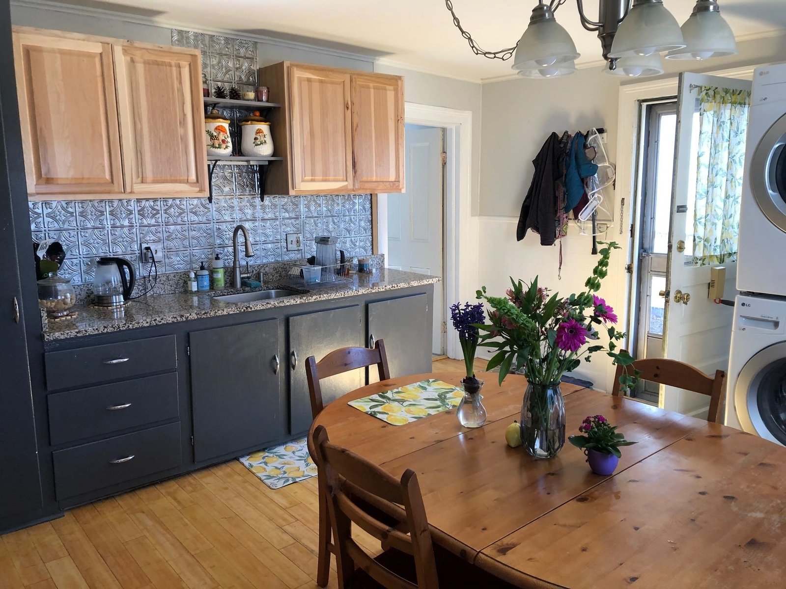 Kitchen with side door to fenced in yard