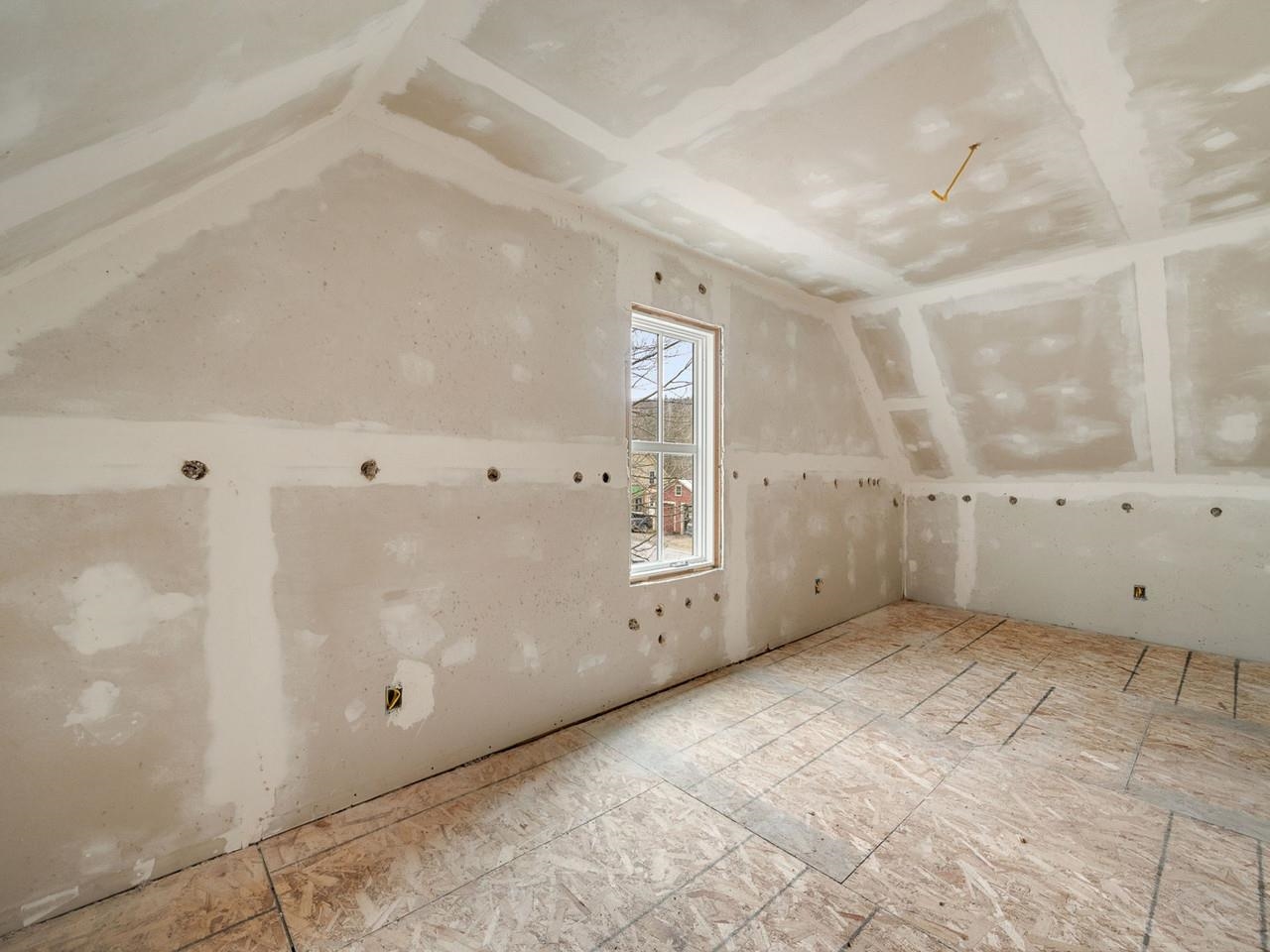 Sheetrocked bedroom
