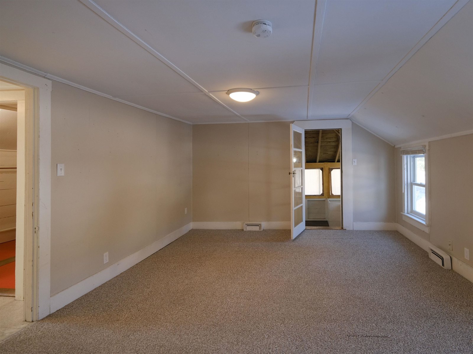 Unit 2 - Living/Dining Rooms - Door to enclosed porch