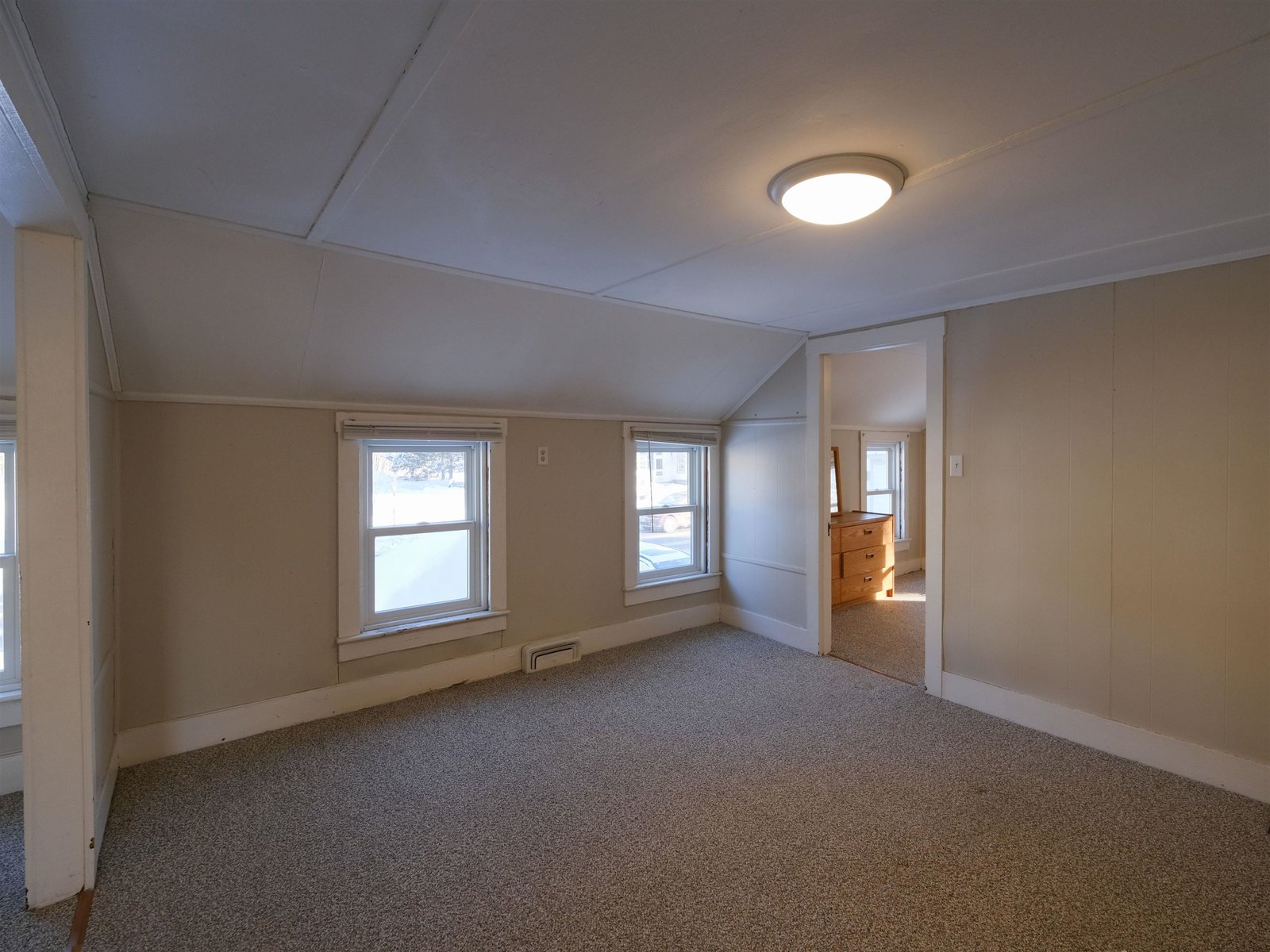 Unit 2 - Living/Dining Rooms - Door to enclosed porch