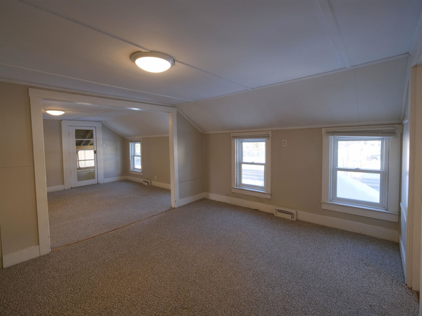 Unit 2 - Living/Dining Rooms - Door to enclosed porch