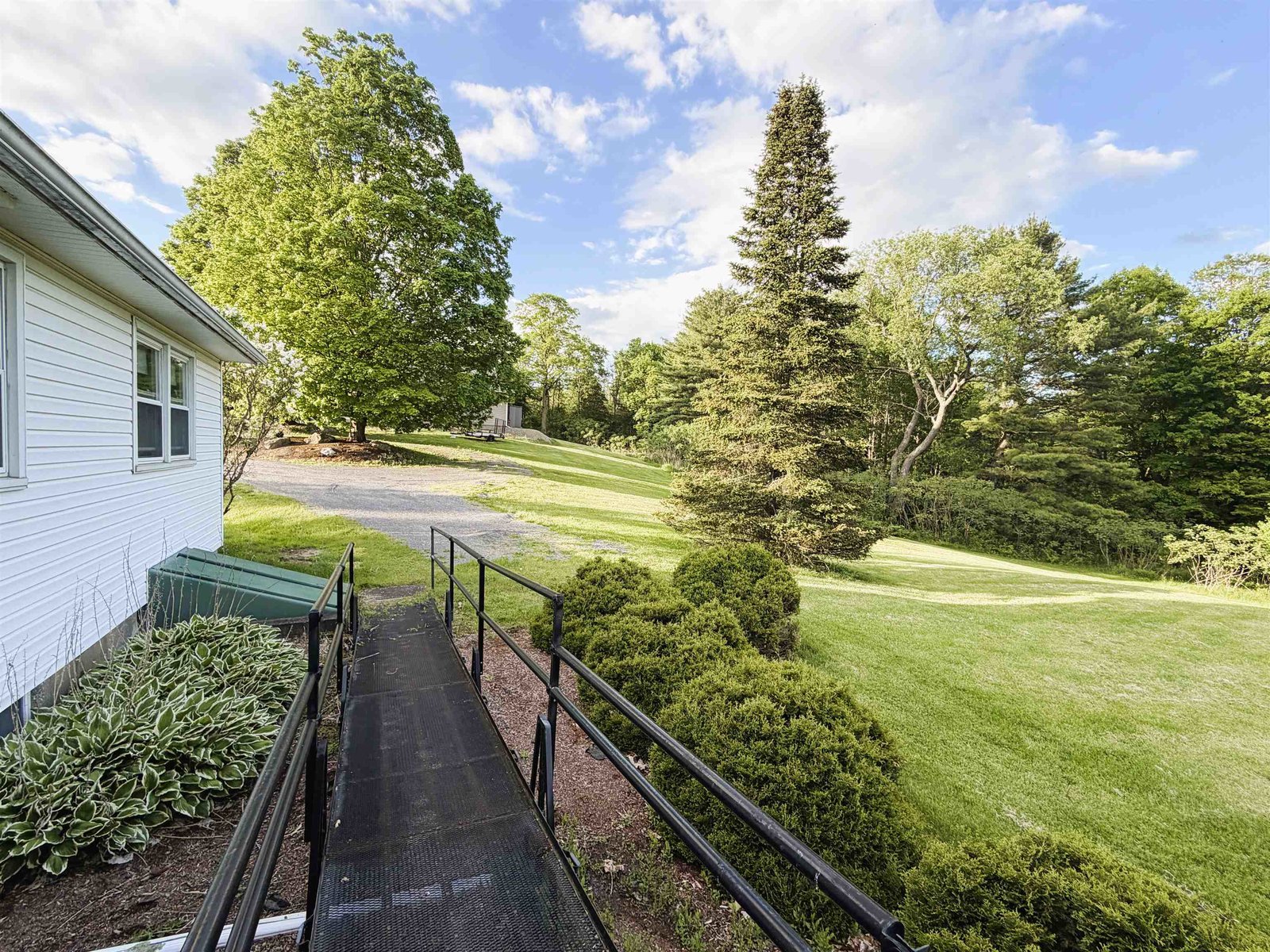 Handicap Ramp & View of Bilco Door to Basement