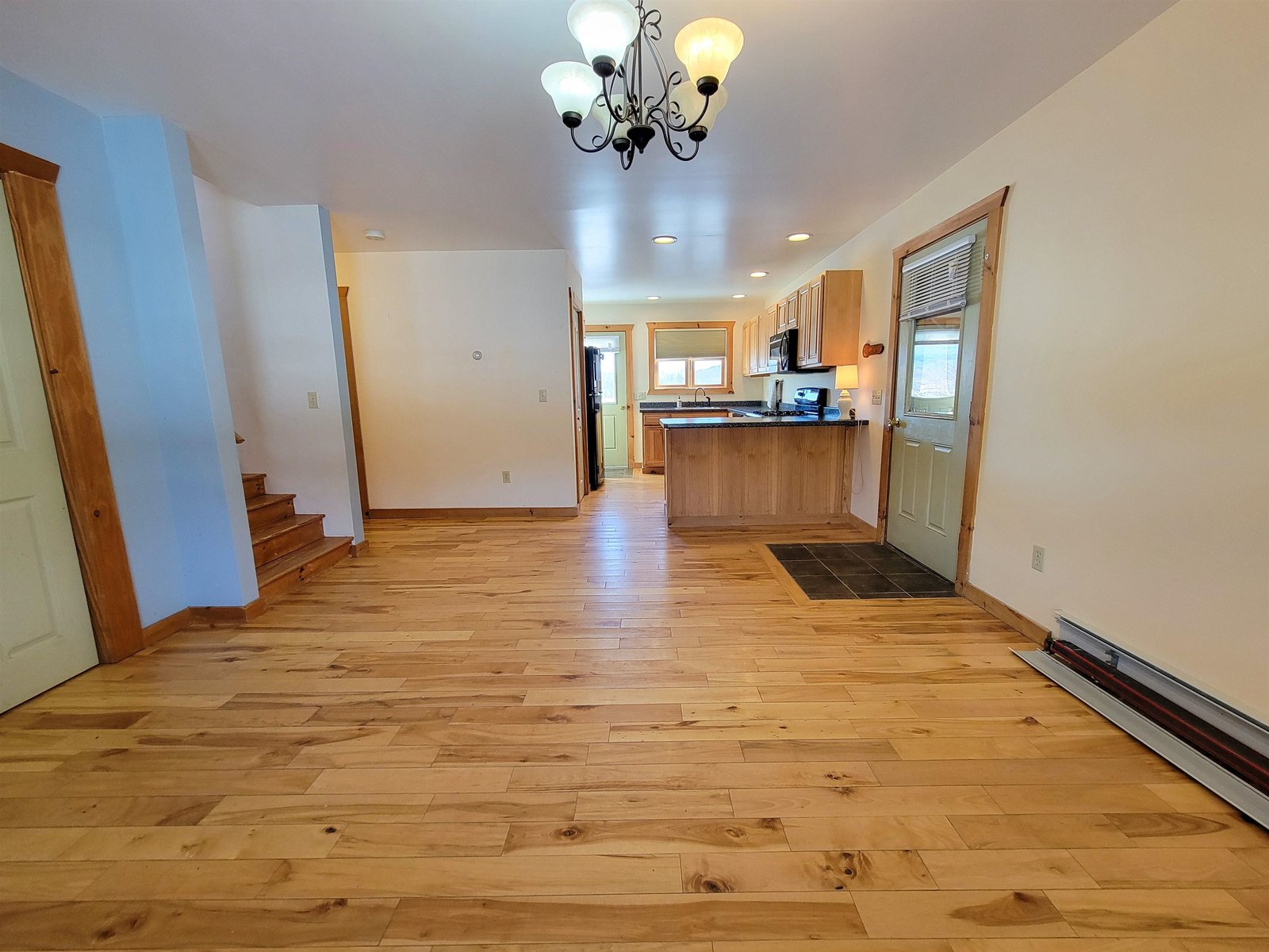 Dining to Kitchen w/Door to Garage on Right