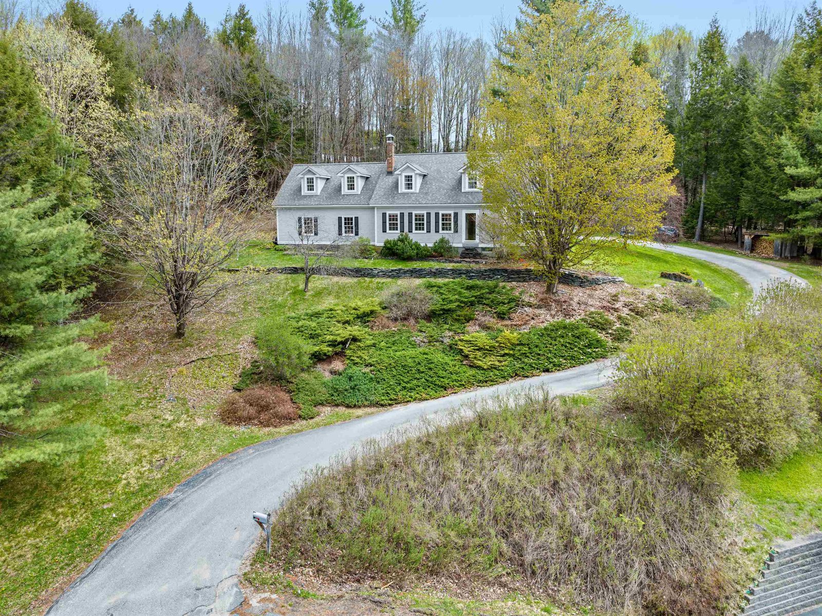 secluded setting, sits above the road
