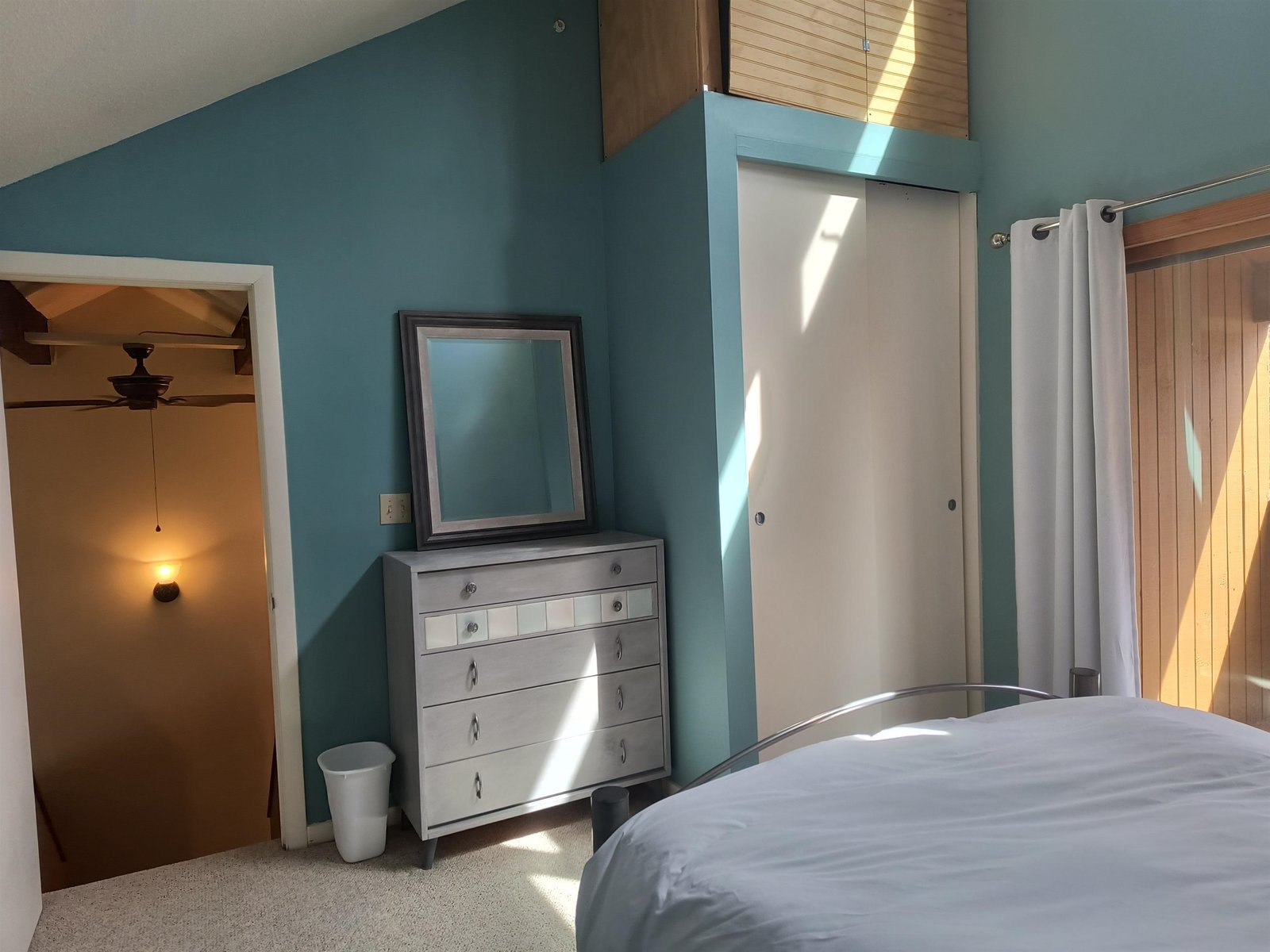 Closet and elevated storage area, bedroom