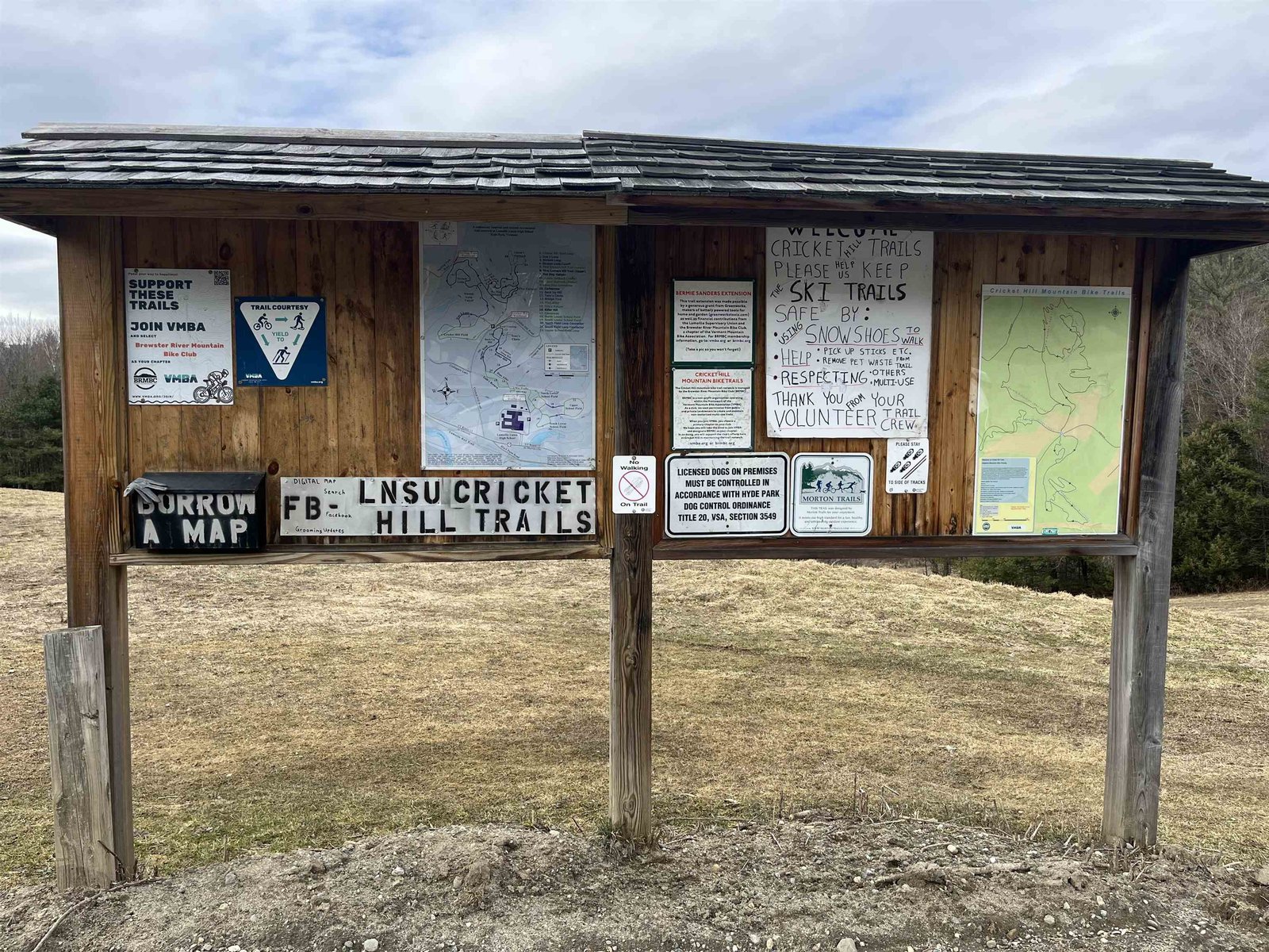 Sign of Cricket Hill Trail-head on directly adjacent school property