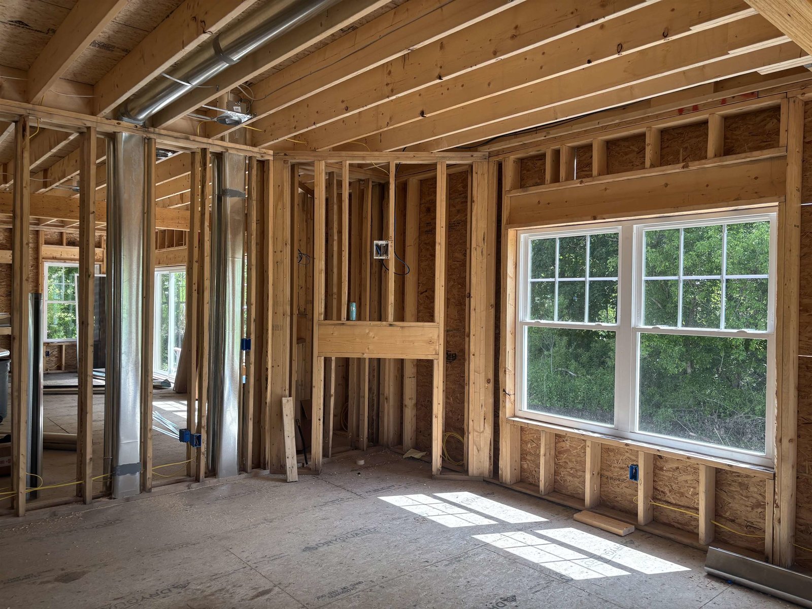 Open living area with corner gas frieplace